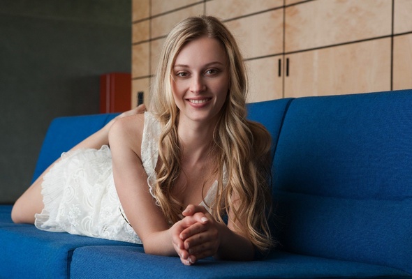 carisha, blonde, hat, dress, smile, young, sexy babe, blonde, long hair, laying, blue, sofa, smile, erotic, sexy, decollete, close up, eyes, face