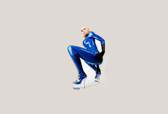latex, blonde, sexy, heels, minimalist wall, susan wayland, blue, catsuit, fullsuit, gloves, shiny, rubber, fetish, plastic, plateau boots, tight clothes