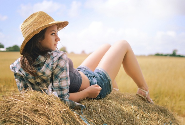 brunette, sexy girl, shirt, jeans shorts, hat, hay, sexy legs, outdoors