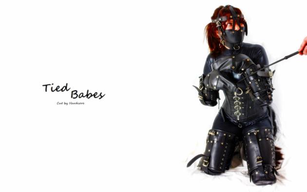 redhead, fetish, kneeling, tight clothes, lycra, catsuit, black, leather, bondage gear, completely, fixed, slave, speechless, bound, whip, masked, fetish babe, minimalist wall, own cut, bdsm, widescreen cut