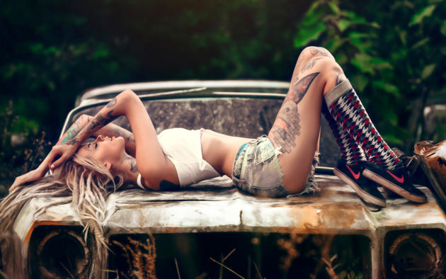 model, shorts, socks, tattoos, gym shoes, rusty car