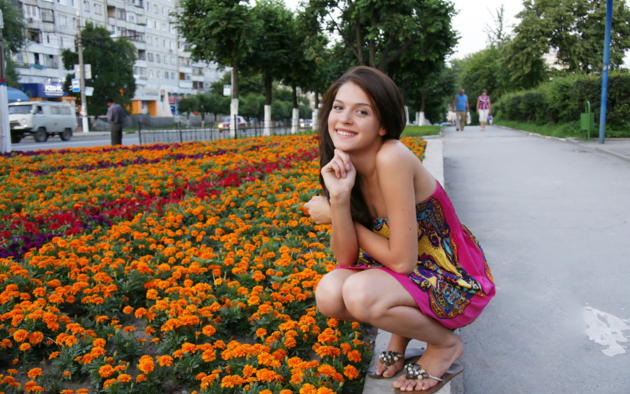 liza j, young, non nude, beauty, outdoor, city, street, mini dress, smile, squatting, flowers