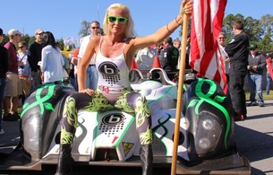 blonde, slim, amateur, tight clothes, sexy babe, long hair, posing, sitting, sexy, dressed, white, top, shiny, lycra, leggings, leather, ankle boots, racecar, babes and cars, shiny clothes, cuty, smile, decollete, sunglasses, pit girl, flag, babes in boots