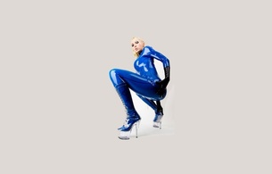 latex, blonde, sexy, heels, minimalist wall, susan wayland, blue, catsuit, fullsuit, gloves, shiny, rubber, fetish, plastic, plateau boots, tight clothes