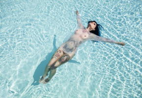 brunette, smooth pussy, shaved, tattoos, piercing, lying, pool, riae, riae suicide, suicide girls, floating, see through, pierced nipples, dark hair, nose ring