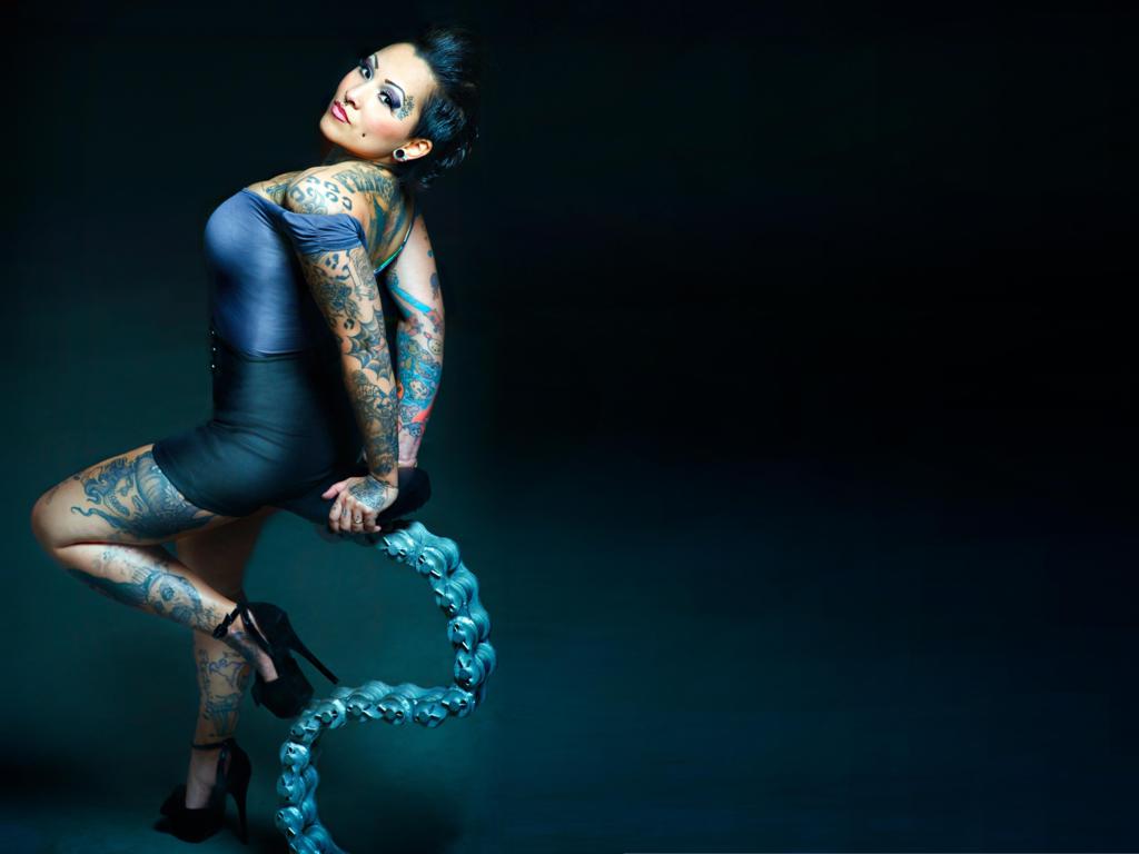 envy, envy von needles, brunette, updo hairstyle, sexy babe, tattoos, sexy dressed, posing, body art, tattoo, piercing, erotic art, pin up style, modern, curves, female, femme fatale, full size cut, widescreen cut, heels, legs, plateau heels, hi-q
