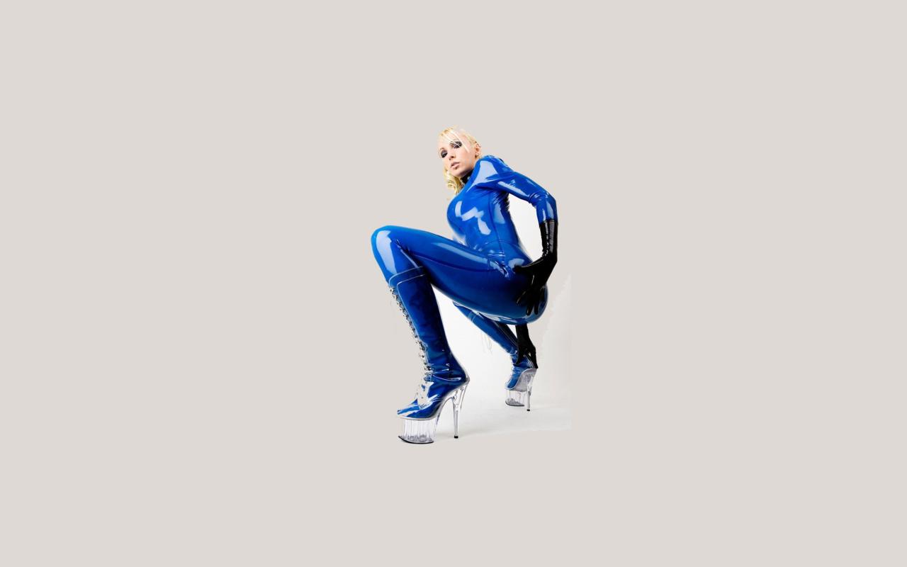 latex, blonde, sexy, heels, minimalist wall, susan wayland, blue, catsuit, fullsuit, gloves, shiny, rubber, fetish, plastic, plateau boots, tight clothes