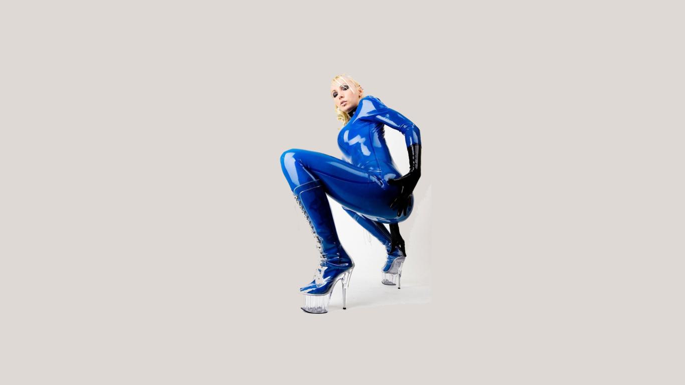 latex, blonde, sexy, heels, minimalist wall, susan wayland, blue, catsuit, fullsuit, gloves, shiny, rubber, fetish, plastic, plateau boots, tight clothes
